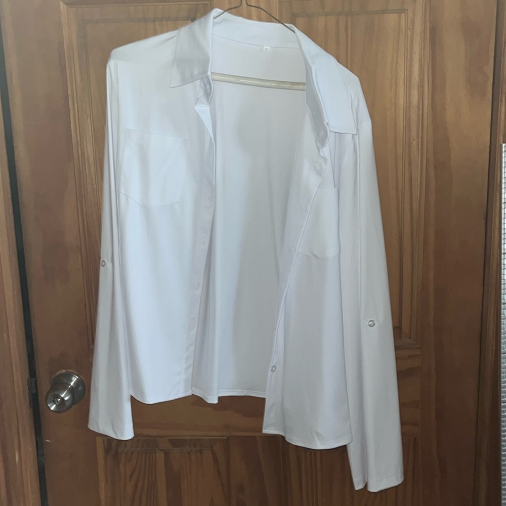 Brand new white collared shirt. Size runs small. More like a large